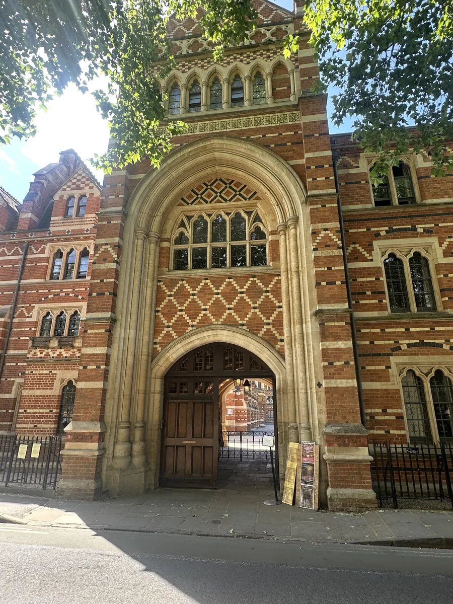The gateway arch into Keble College, framed by Butterfield's banded red and cream brick